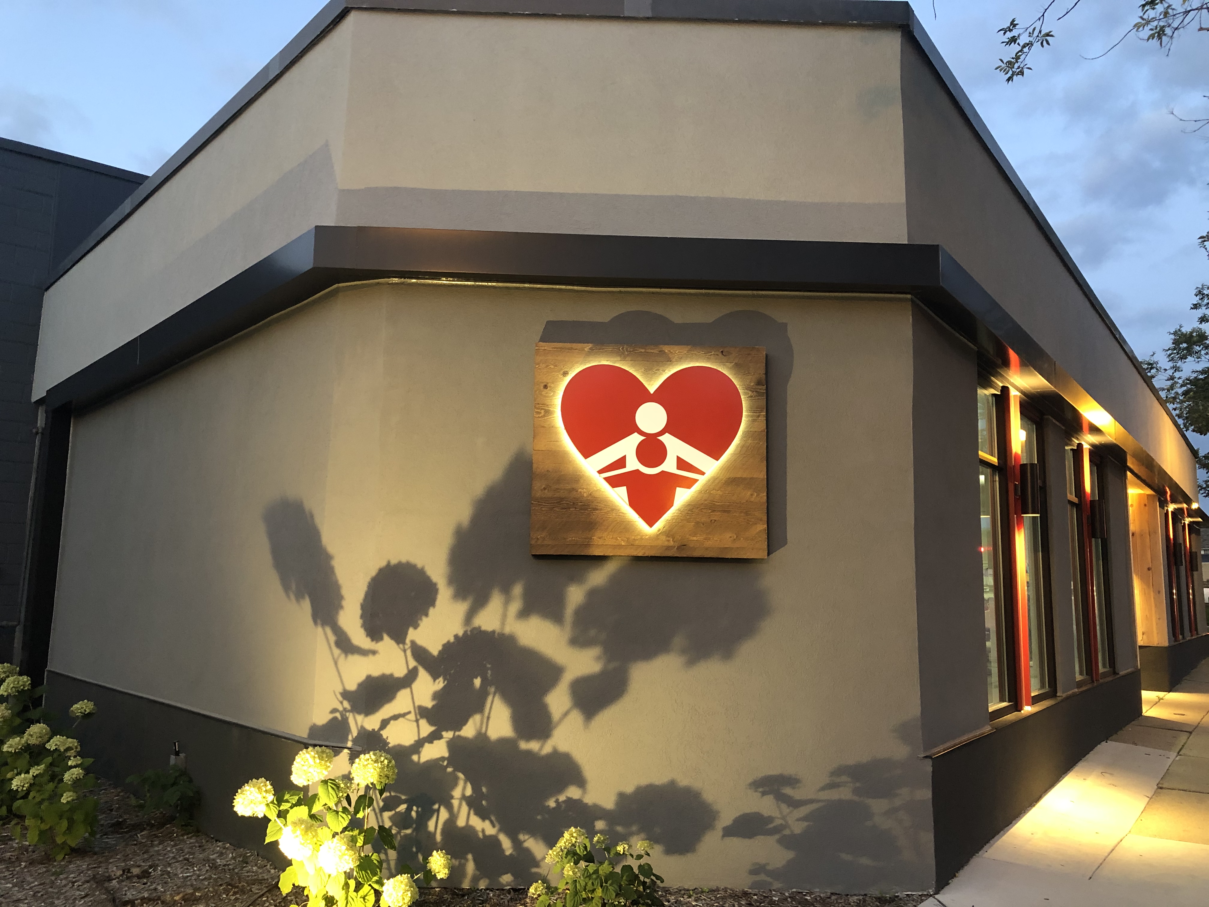 Father Gene's Help Center building exterior at dusk